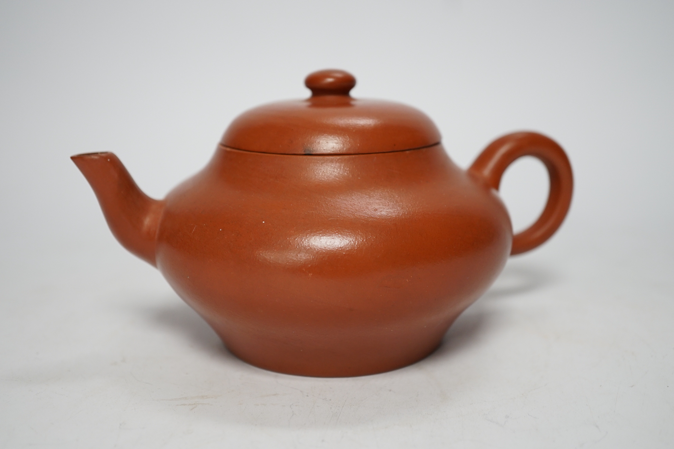 A 19th century Chinese Yixing teapot and cover, possibly for the Thai market, 9cm tall